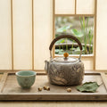 Pure 999 Fine Silver Handcrafted Silver Teapot with Intricate Lotus Relief and Woven Rattan Handle - Handicraft